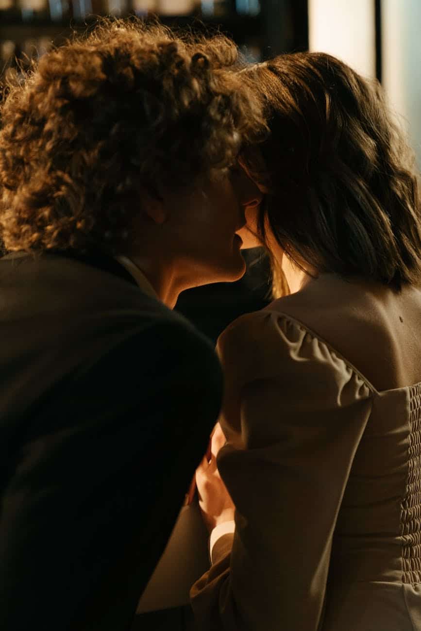 man and woman kissing