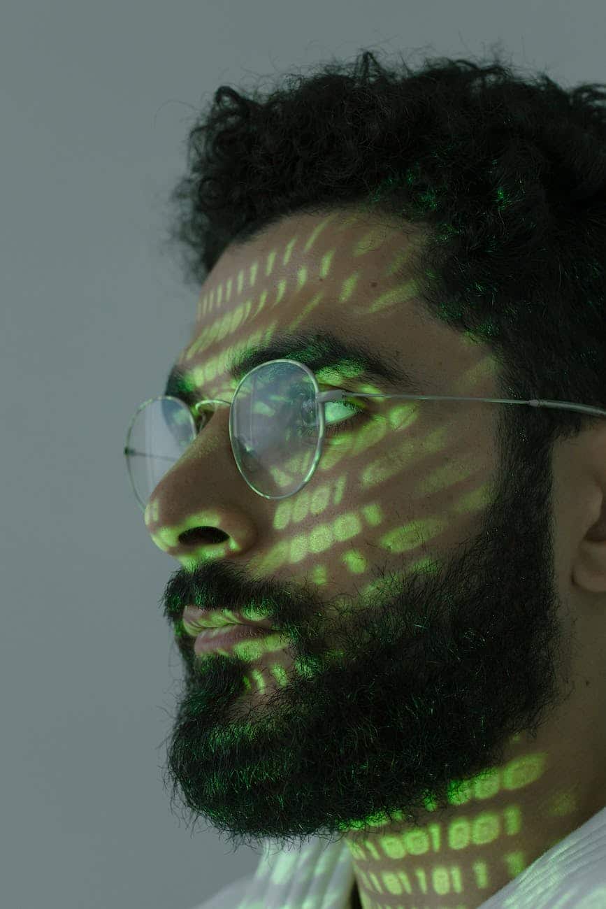 man with binary code projected on his face