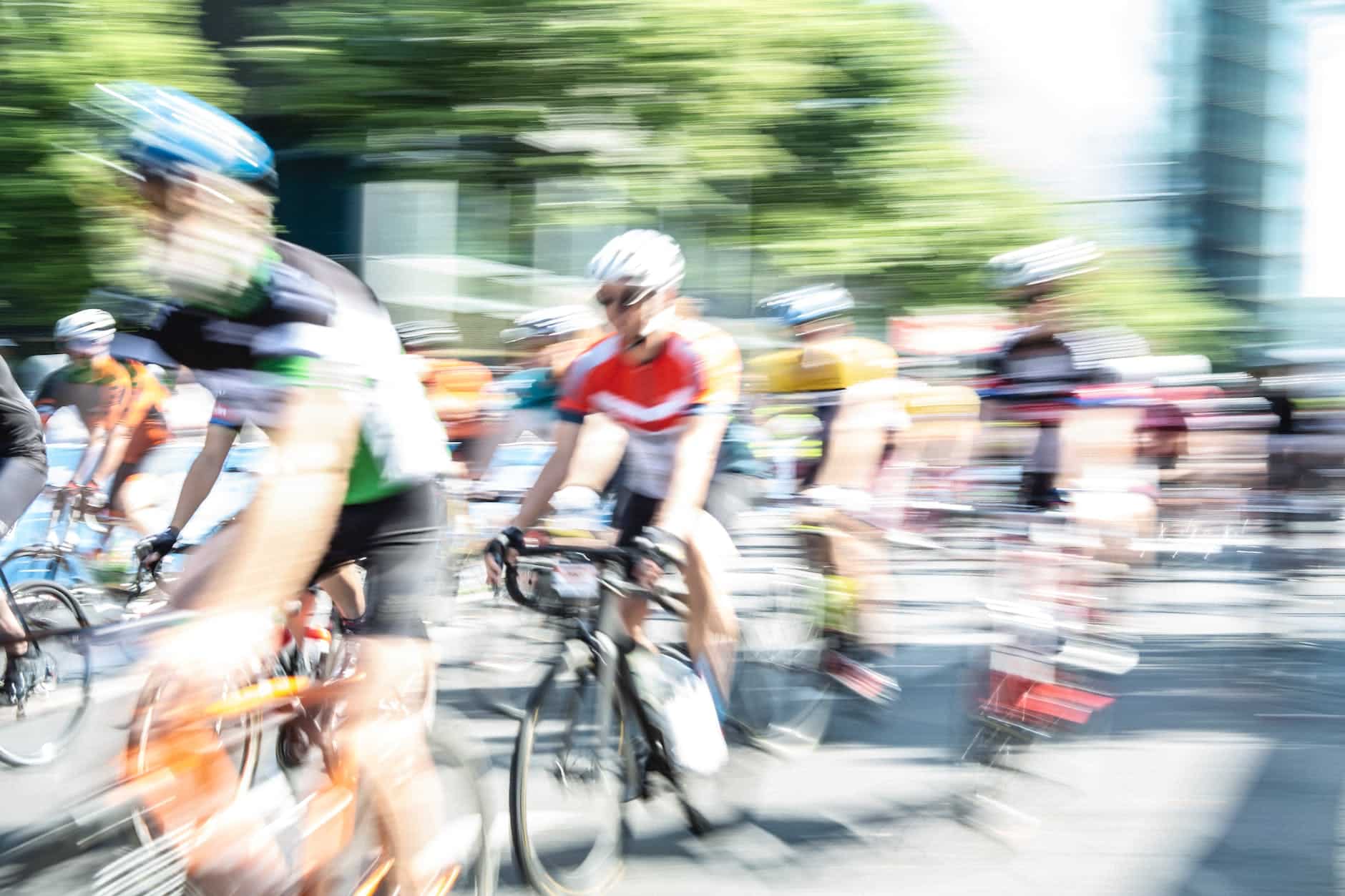 people blur bikes bicycles
