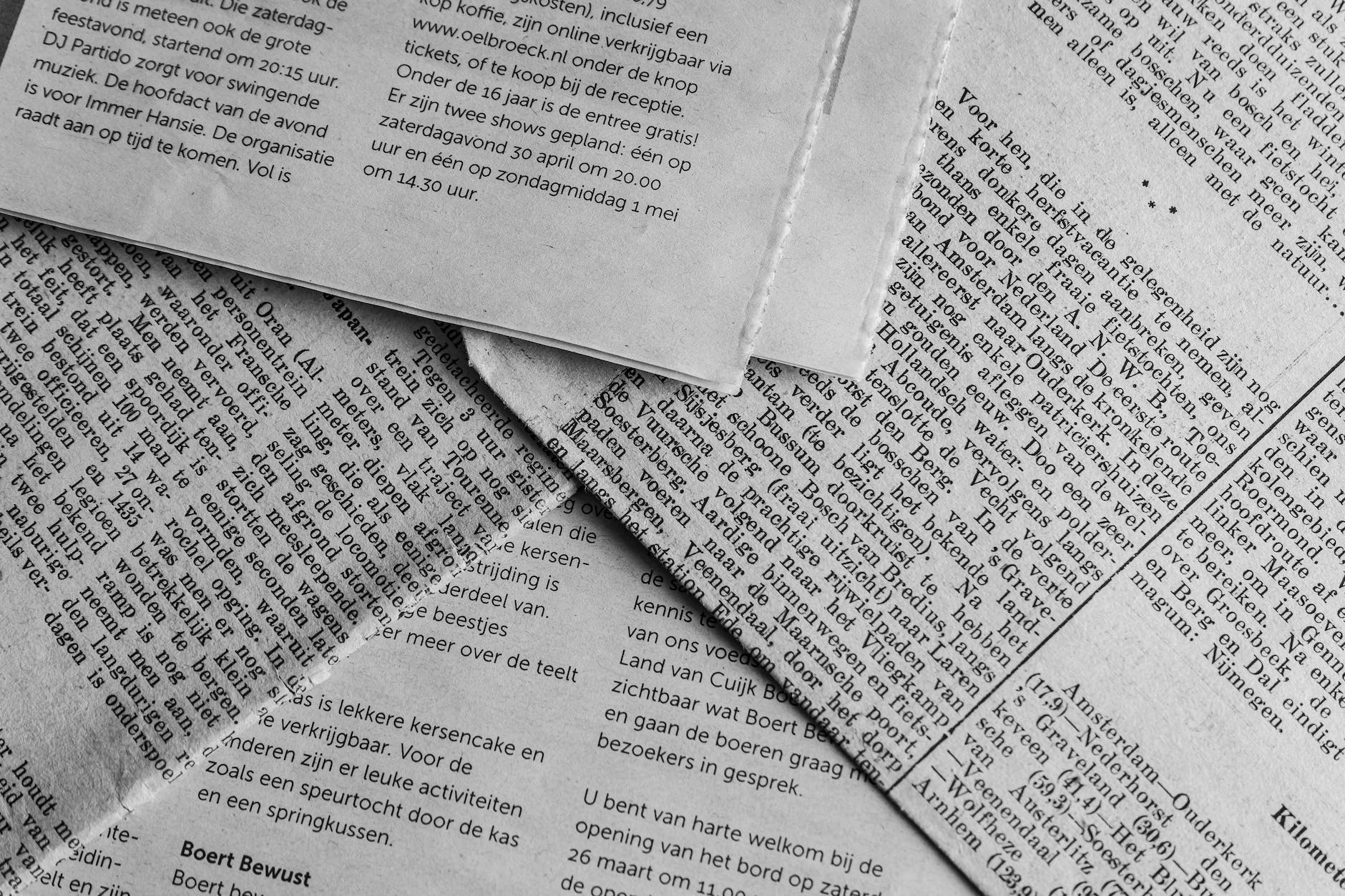 a close up shot of newspapers
