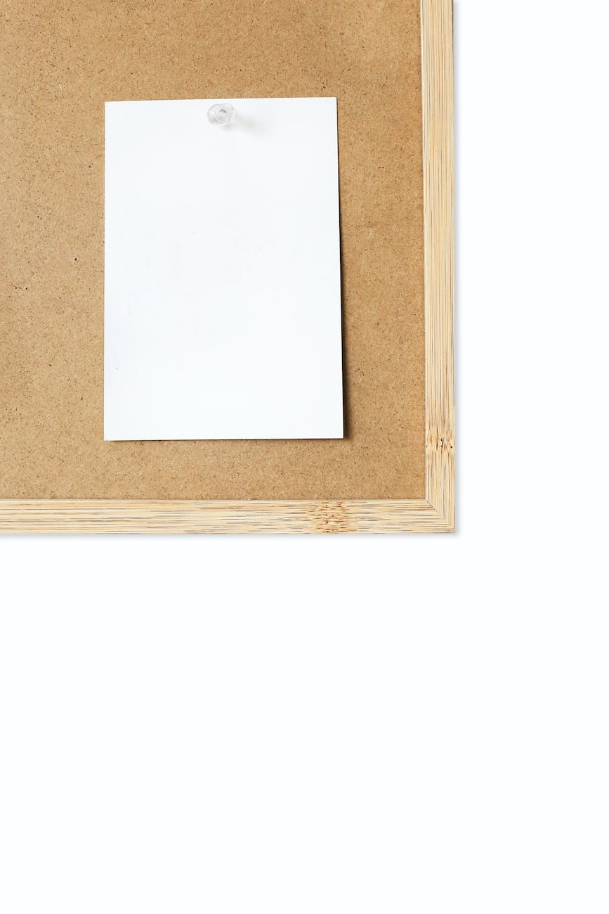 blank white stick on wooden board