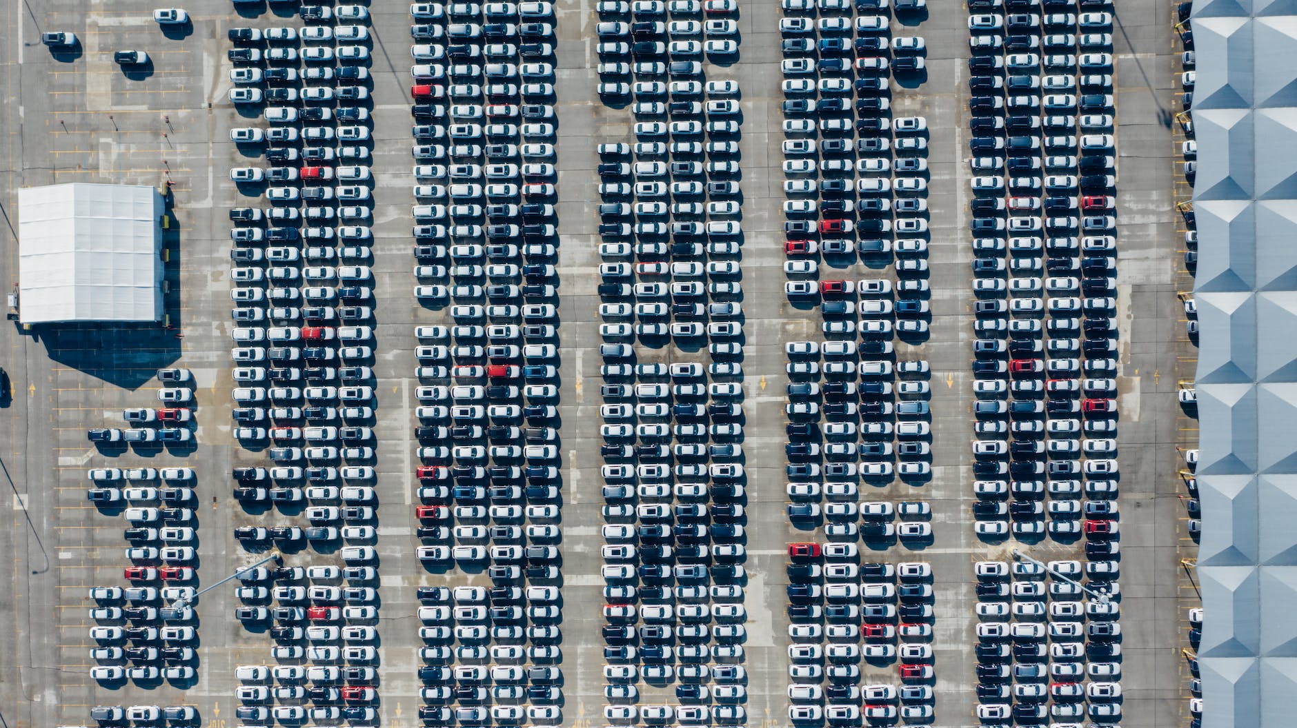 outdoor parking lots full of various cars
