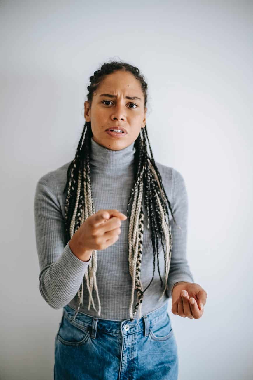 ethnic woman frowning face and pointing at camera